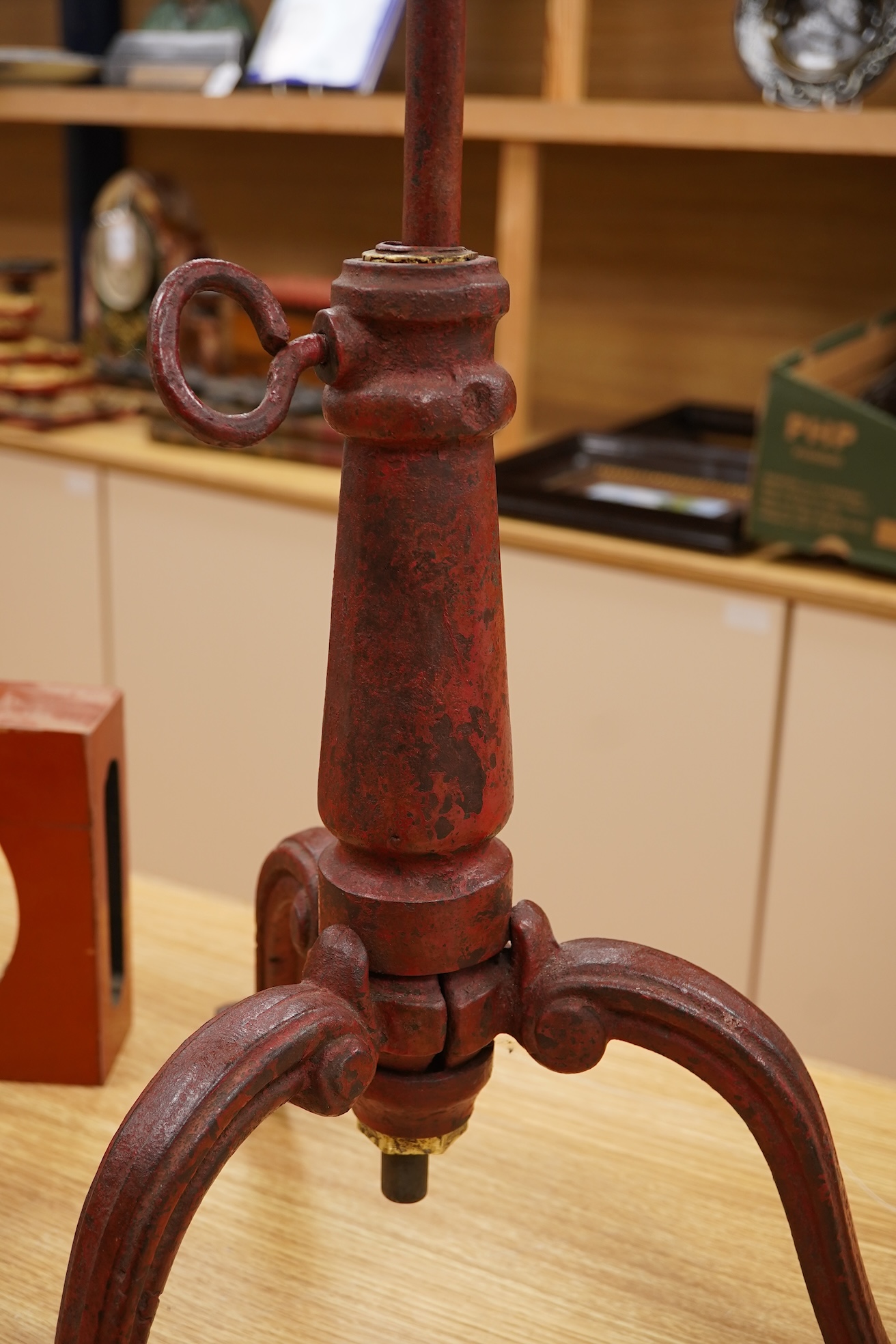 A 19th century red japanned (heavy) cast iron telescopic tripod base, 63cm minimum